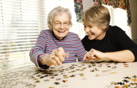 an elderly and a caregiver
